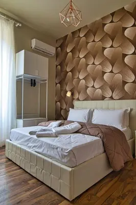 a bedroom with a large bed with a red blanket at GUEST HOUSE GIL - ROME Colosseum Area in Rome