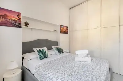 a bedroom with two beds with towels on them at Minerva al 5 in Rome