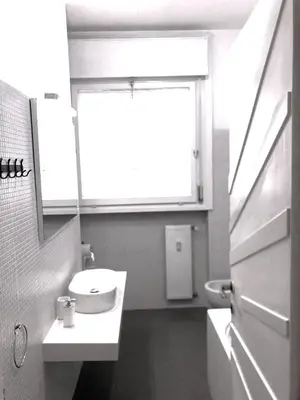 a bathroom with a sink and a mirror at Rizzola casa e appartamento per vacanze in Rome
