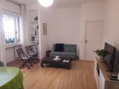 a living room with a couch and a table at Rizzola casa e appartamento per vacanze in Rome