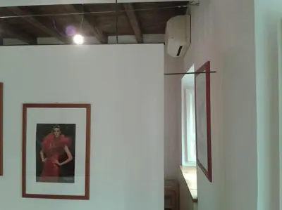 a picture of a man on a wall in a room at Barberini 360 in Rome