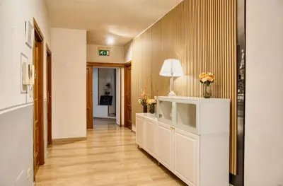 a kitchen and living room with a table and chairs at DomusFebo-VaticanSuites in Rome