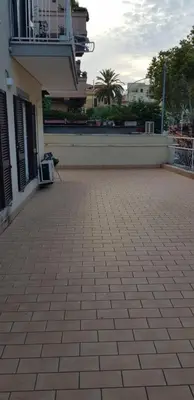 a brick patio in front of a building at Trastevere Residenze in Rome
