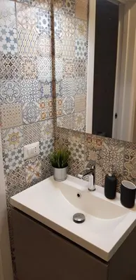 a bathroom with a sink and a mirror at Trastevere Residenze in Rome