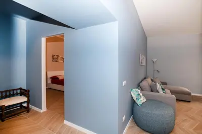 a living room with a couch and a bed at Domus Pietrae in Rome