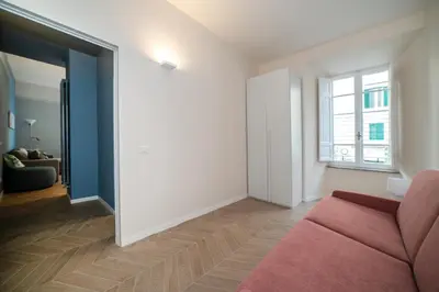 a living room with a couch and a window at Domus Pietrae in Rome