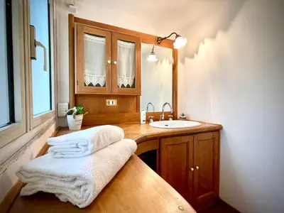 a bathroom with a sink and a mirror at Colosseum Luxury Apartment in Rome