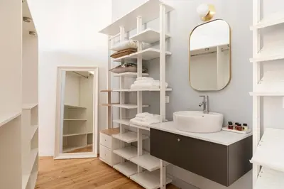 a bathroom with a sink and a mirror at Elegante Dimora a Trastevere in Rome