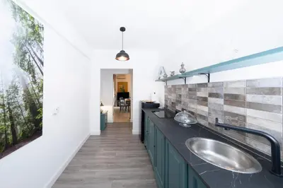 a bathroom with two sinks and a large window at San Peter Terrace View in Rome