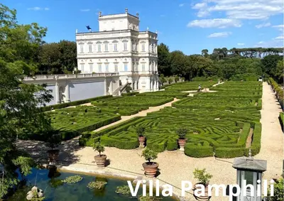 a large building with a garden in front of it at San Peter Terrace View in Rome