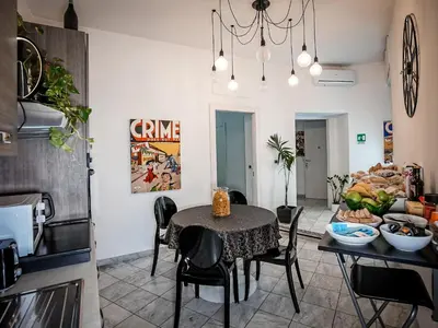a kitchen and dining room with a table and chairs at Gate 40 Roma in Rome