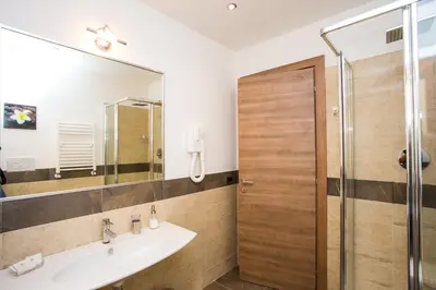 a bathroom with a sink and a shower at Trastevere's Friends in Rome