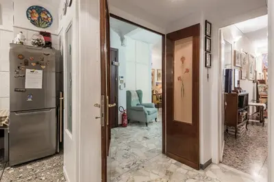 a hallway with a door leading to a living room at Appartamento Roma Centro in Rome