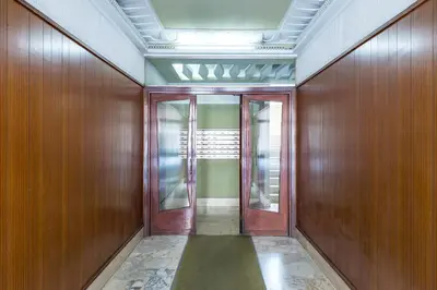 an empty hallway with wooden walls and doors at Appartamento Roma Centro in Rome