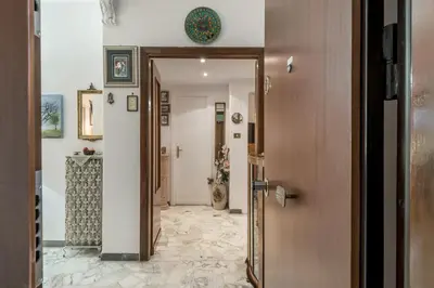 a hallway with a door leading into a room at Appartamento Roma Centro in Rome