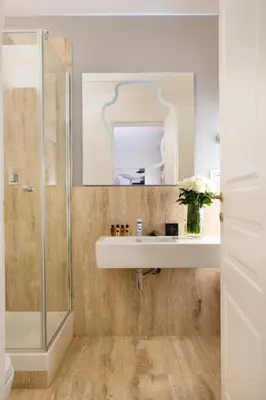 a bathroom with a sink and a mirror at Via Del Corso Home Roma in Rome