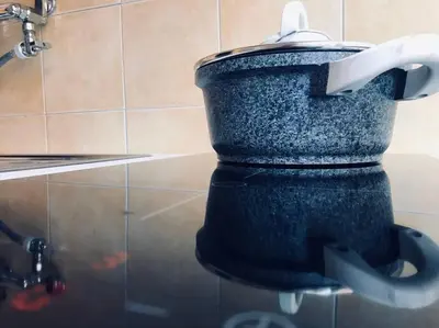 a black bucket in a bathroom with a faucet at A Place in Prati in Rome