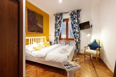 a small bedroom with a bed and a chair at Passeggiata al Vaticano in Rome
