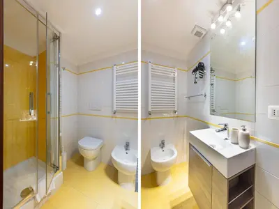 a bathroom with a toilet and a sink and a shower at Passeggiata al Vaticano in Rome