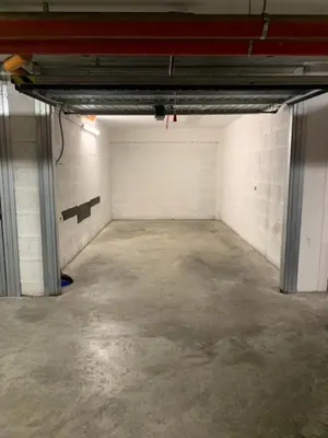 an empty parking garage with a white brick wall at PortamiPortese Trastevere Terrace in Trastevere