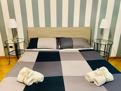 a bedroom with a bed with towels on it at PortamiPortese Trastevere Terrace in Trastevere