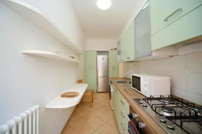 a kitchen with a stove and a counter top at Elisa's Trevi Fountain BuddyRent in Rome