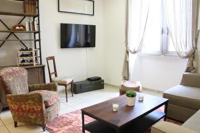 a living room with a couch and a table at Maison Yassi Piazza del Popolo in Rome