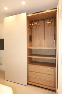 a room with a closet with wooden shelves at Unique Luxury Stay in Rome