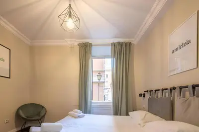 a bedroom with a bed and a window at Ghetto BuddyRent in Rome