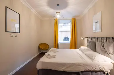 a bedroom with a white bed and a window at Ghetto BuddyRent in Rome