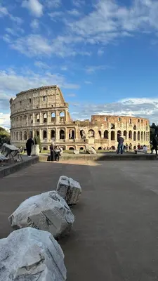 a balcony with a table and chairs on a building at Interno 4 in Rome - Aventino e Circo Massimo in Rome