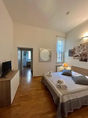 a bedroom with a bed with towels on it at Appartamento Residenza Girasole Vatican in Rome
