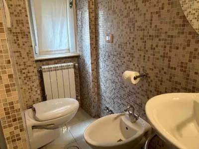 a bathroom with a toilet and a sink at Gabbo - House in Rome