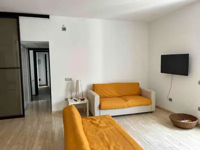 a living room with a couch and a tv at Gabbo - House in Rome