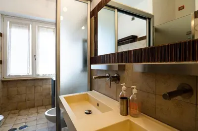 a bathroom with a sink and a mirror at Gabbo - House in Rome