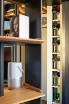 a book shelf with a white box on it at Casa MastroiannI con Terrazzo in Rome