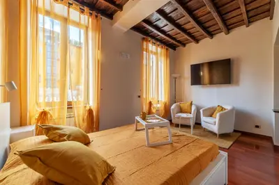 a bedroom with a large bed in a room at GuestHost - Trastevere Leopard'Oro Apartment in Rome