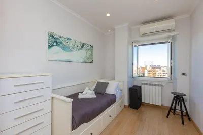 a bedroom with a bed and a window at Piramide view by Rental in Rome in Rome