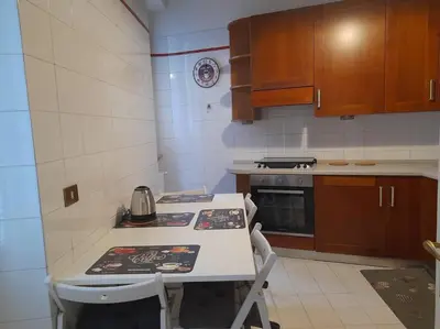 a kitchen with a counter and a stove top oven at Allegra’s House Barberini in Rome