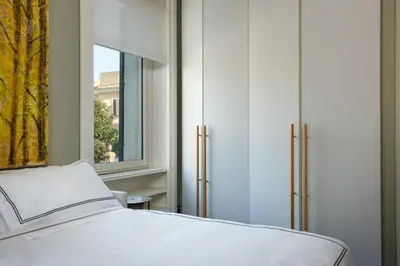 a bedroom with a bed and a window at Casa Loren con Terrazzo in Rome