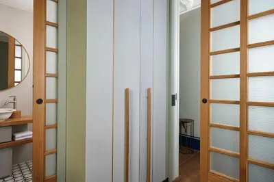 a bathroom with sliding glass doors and a sink at Casa Loren con Terrazzo in Rome