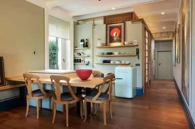 a kitchen with a table and chairs and a refrigerator at Casa Loren con Terrazzo in Rome