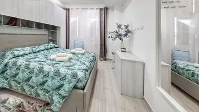 a bedroom with a bed with two pillows on it at FaMaCrì Home in Rome