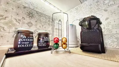 a kitchen counter with two jars of food and a blender at FaMaCrì Home in Rome