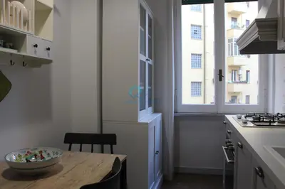 a kitchen with a wooden table with a bowl on it at Casa di Pera in Rome