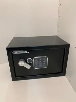 a black microwave oven with a remote control at 6 AL TOP in Rome