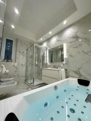 a white bathroom with a tub and a sink and a tub at 6 AL TOP in Rome