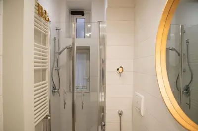 a bathroom with a shower and a mirror at Piazza Testaccio Home appartamento E 2 Accogliente e Silenzioso in Rome