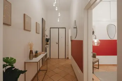 a hallway with a room with two doors and plants at Boho Chic Apartment By Nosdom Properties in Rome