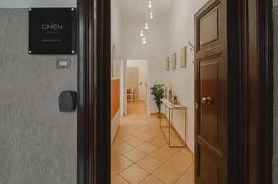 a hallway leading to a room with a door at Boho Chic Apartment By Nosdom Properties in Rome